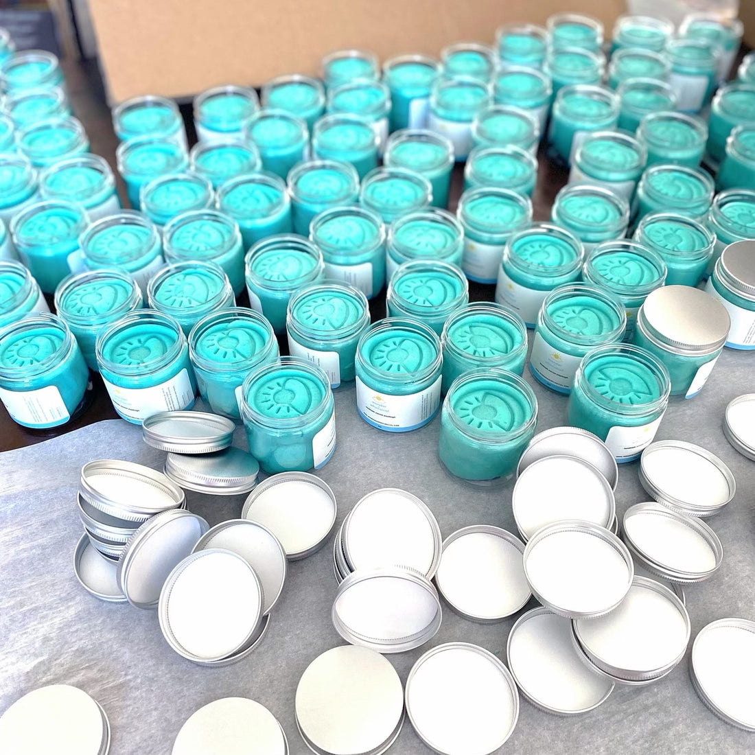 A million jars of unopened teal playdough 